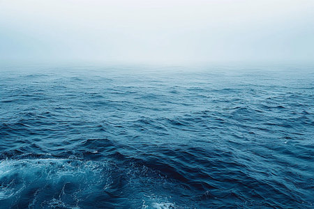 Blue sea with waves and foam in a foggy day. Natural backgroundの素材