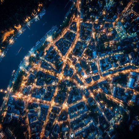 Aerial city view with crossroads and roads, houses, buildings, parks and parking lots. Helicopter drone shot. Wide Panoramic image.の素材