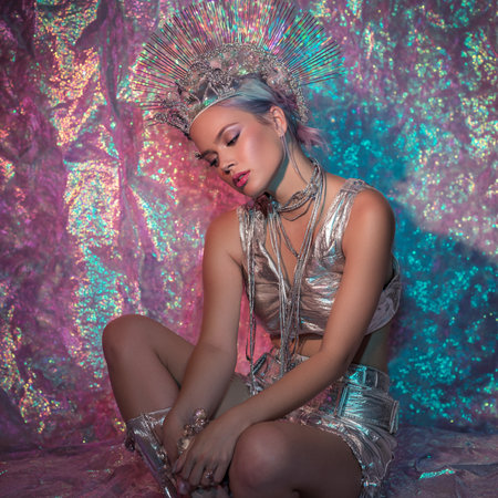 Beautiful girl in a silver dress and a crown on her head.の素材