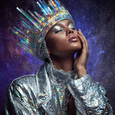 Portrait of a beautiful young woman in silver costume. Fashion shot.の素材