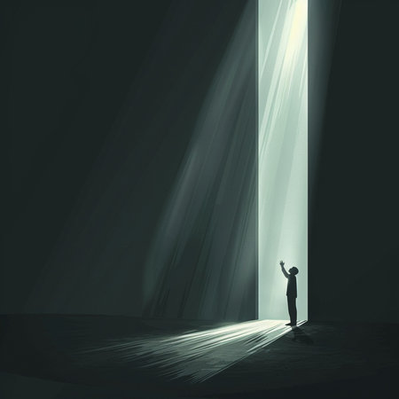 Silhouette of businessman standing in front of light coming from doorの素材