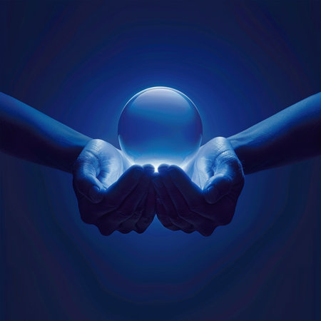two hands holding a crystal ball on a dark blue background, conceptual imageの素材