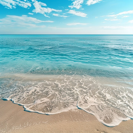 Turquoise sea waves gently rolling onto a sandy beach with mountains and a bright blue sky in the background. Peaceful Mediterranean coastline on a sunny day, perfect as a backgrouの素材