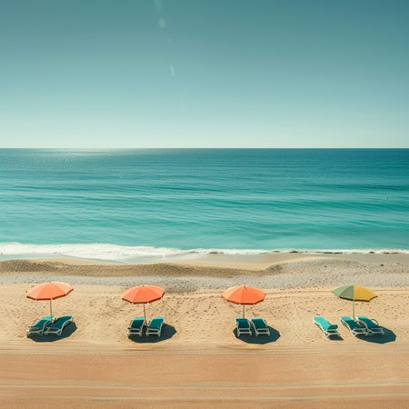 Umbrellas and sun loungers on the beach in Algarve, Portugalの素材
