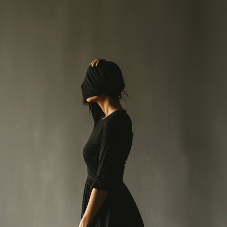 Back view of beautiful young woman in black dress and turban on her head.の素材