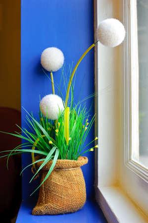 Flower pot on window sillの写真素材