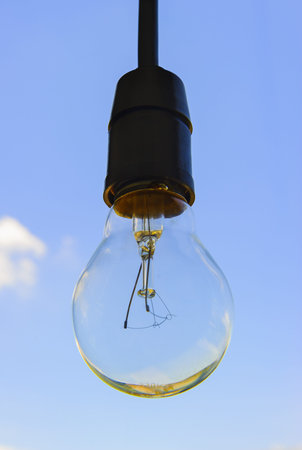 Big electric bulb with sky background