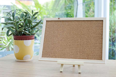 Empty cork board on the tableの写真素材