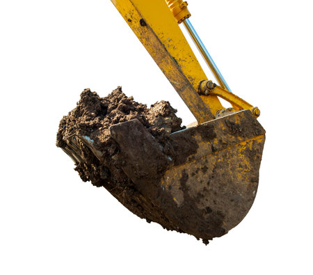 Bucket of a front loader scooping dirt