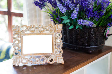 Empty photo frame on the tableの写真素材