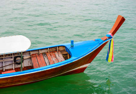 Long tail wooden boatの写真素材