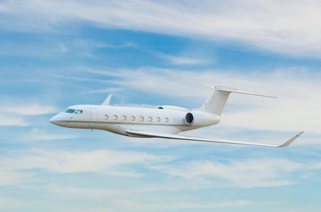 Private jet airplane flying in sky