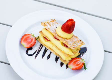 Strawberry mille feuille cake in white plateの写真素材
