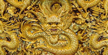 Golden dragon sculpture carving in templeの写真素材