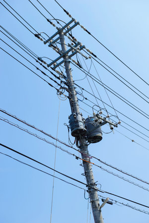 Electricity post with blue sky backgroundの写真素材