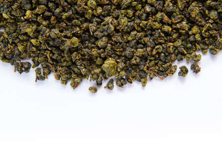 Heap of green tea on white backgroundの写真素材