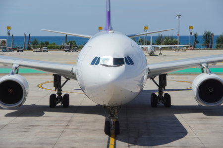 Commercial airplane taxiing to gate