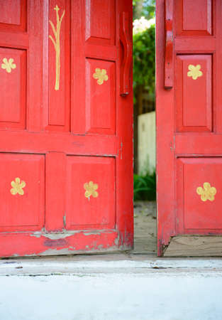 Old red wooden door openの写真素材