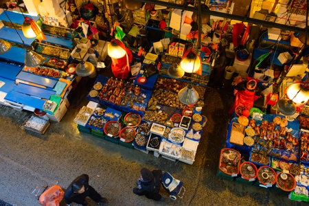 Seoul, South Korea - December 17, 2015 : Aerial view of shoppers at Noryangjin Fisheries Wholesale Market December 17, 2015 in Seoul, South Korea. The 24 hour market has over 700 stalls selling fresh and dried seafoodのeditorial素材