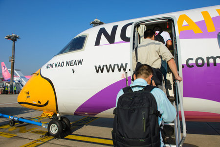 Bangkok, Thailand - November 26, 2014 : Unidentified people walked to BOMBARDIER Q400 NextGen of Nok...
