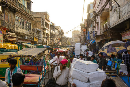 New Delhi, India - April 16, 2016 : Overcrowded street in old town with smog, dangerous electric lines and Jama masjidのeditorial素材