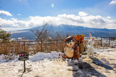 Tokyo, Japan - January 13, 2017 : Raccoon dog and rabbit dolls at Mount Tenjoyama, An observation deck overlooking Mount Fuji and Lake Kawaguchikoのeditorial素材