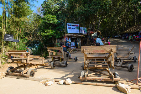 Chiang Mai, Thailand - November 27, 2014 : Unidentified tourists are prepared for play wooden sleigh wheeled on November 27, 2014 at Doi Mon Jam, Chiang Mai, Thailandのeditorial素材