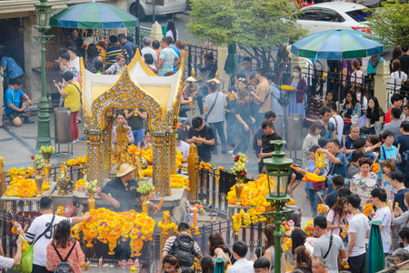 Bangkok, Thailand - January 27, 2018 : People are paying respect to the Erawan Shrine, which is a Hindu shrine housing a statue of Phra Phrom, the Thai representation of the Hindu creation God Brahmaのeditorial素材