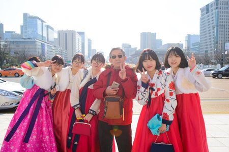 Seoul, South Korea - December 16, 2015 : Unidentified tourist man with woman in hanbok, the traditional korean dressのeditorial素材