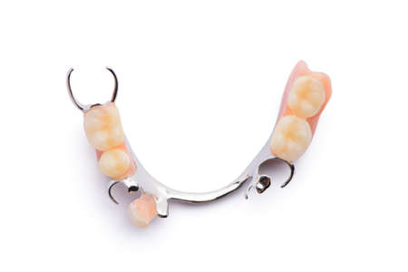 Removable partial denture. Isolated on white background.の写真素材