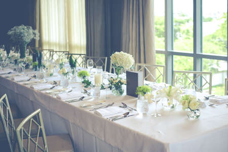 Wedding reception table set with flowerの写真素材