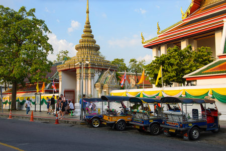 Bangkok, Thailand - November 12, 2018 : Tricycle taxi of Thailand on street and background of Wat...