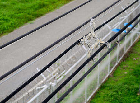 Spacer damper hold electric cable wiresの写真素材