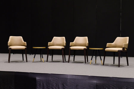Empty chairs on stage ready for seminar