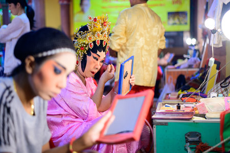 Bangkok, Thailand - October 2, 2019 : Chinese opera actor self makeup on behind stageのeditorial素材