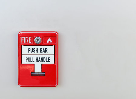 Red box of fire alarm on wall