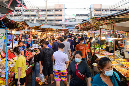 Bangkok, Thailand - February 28, 2021 : People wear surgical mask walking at Din Daeng Market during pandemicのeditorial素材