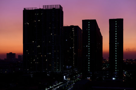 Silhouettes of Bangkok cityscape on awesome sunset background
