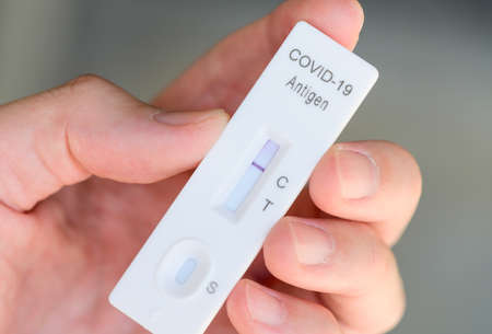 Rapid antigen test kit with negative result during swab covid-19 testingの写真素材