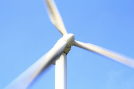 wind turbine that spins and creates renewable electricity.の写真素材