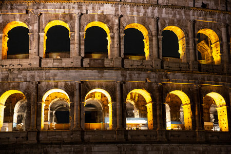 Night photo of the ancient Colosseum of Rome located in the city center, travel reportsの写真素材