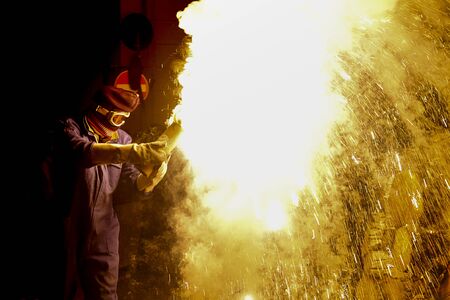 A person blows up a big firecracker and creates a gigantic blaze bright..の写真素材