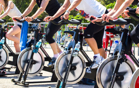 People who are riding on an exercise bike in a public urban park in Imperia.
-----Imperia, IM, Italy - May 18, 2014: People perform a spinning session outdoors in an urban park of liguria. Athlets training an their special bikers to keep healthyのeditorial素材