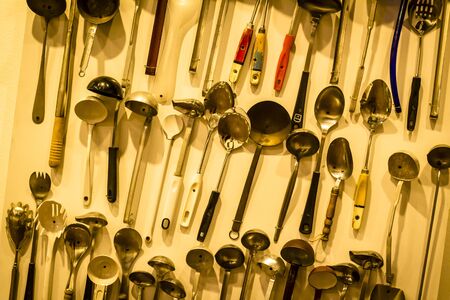 Various kitchen utensils in wood create a texture.の写真素材