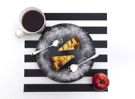 An Apple Pie shot from above, the spoons are shaped like a skull.の写真素材
