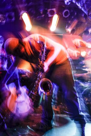 Musician with Sax photographed with an explosive effect of lights and motionの写真素材