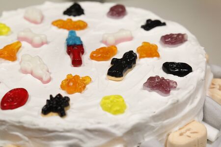 Cake covered with very good gummy candiesの写真素材