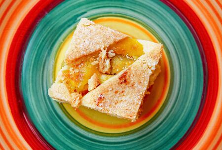 Fruit cake on a beautiful colored plateの写真素材