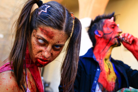 Ferrara, Italy, 16/09/2017: Funny cosplay dressed as Zombie and  devil, photographed during a...