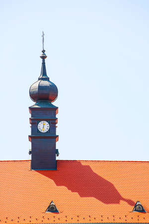 Front view of an ancient dark tower in the city centre of Budapestの写真素材